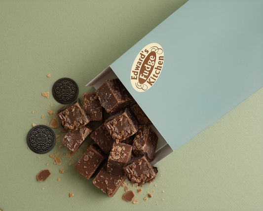 Box of chocolate fudge with Oreo cookies on a green and blue background, featuring Edward Field Kitchen logo.